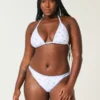 Braguita de bikini atrevida con tirantes y bordado en la parte superior de la pierna