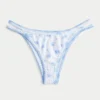 Braguita de bikini atrevida con tirantes y bordado en la parte superior de la pierna