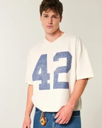 Camiseta de fútbol americano con estampado gráfico, oversize y corte corto.