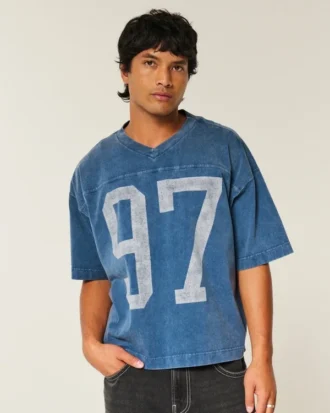 Camiseta de fútbol americano con estampado gráfico, oversize y corte corto.