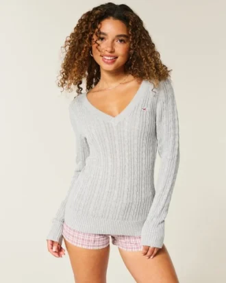 Jersey de cuello en V con diseño icónico de punto trenzado