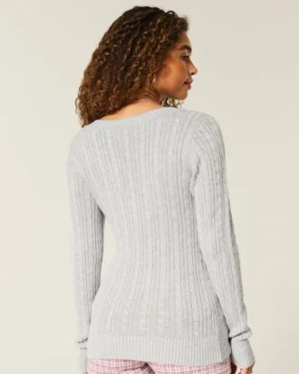 Jersey de cuello en V con diseño icónico de punto trenzado