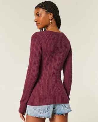 Jersey de cuello en V con diseño icónico de punto trenzado