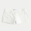 Mini shorts vaqueros blancos desgastados de talle bajo