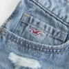Mini shorts vaqueros bordados de talle ultra bajo