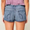 Mini shorts vaqueros desgastados de talle ultra bajo y lavado medio