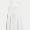 Mini vestido babydoll con tirantes anudados