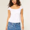 Minifalda pantalón vaquera bordada con cadena y lavado medio