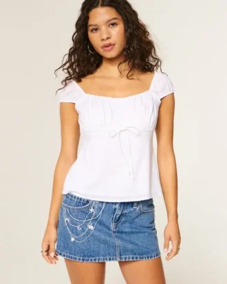 Minifalda pantalón vaquera bordada con cadena y lavado medio
