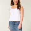 Minifalda pantalón vaquera bordada de talle bajo