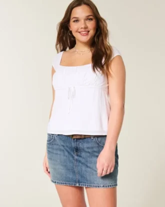 Minifalda pantalón vaquera bordada de talle bajo
