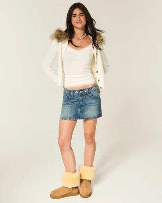 Minifalda pantalón vaquera bordada de talle bajo