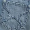 Minifalda pantalón vaquera con bolsillo bordado con estrella