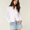 Minifalda pantalón vaquera con tachuelas y lavado claro