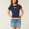 Minifalda pantalón vaquera de talle bajo con lazo bordado
