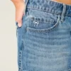 Minifalda pantalón vaquera de talle bajo con lazo bordado