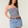 Minifalda pantalón vaquera de talle bajo y lavado medio