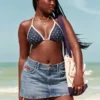 Minifalda pantalón vaquera de talle bajo y lavado medio con bandera bordada