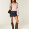 Minifalda pantalón vaquera de talle bajo y lavado oscuro