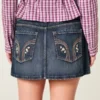 Minifalda pantalón vaquera de talle bajo y lavado oscuro
