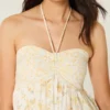 Minivestido babydoll sin tirantes con volantes