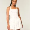 Minivestido con cintura baja y cuello halter