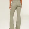 Pantalones acampanados con cintura bordada y talle ultra bajo