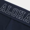 Pantalones acampanados con cintura cruzada y estampado Aloha