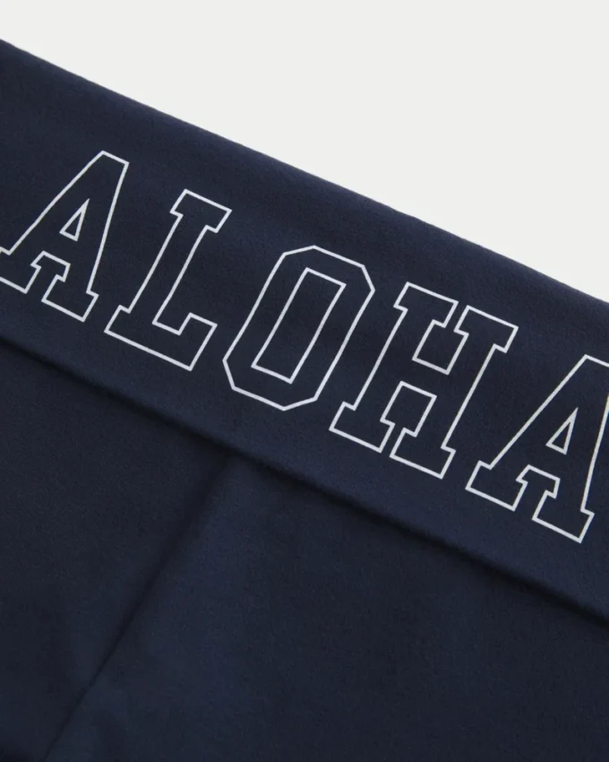 Pantalones acampanados con cintura cruzada y estampado Aloha