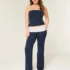 Pantalones acampanados de punto con cintura plegada