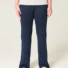 Pantalones acampanados de punto con cintura plegada