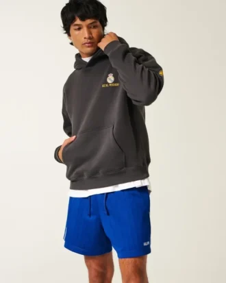 Pantalones cortos de fútbol de punto con logotipo hasta la mitad del muslo