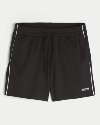 Pantalones cortos de fútbol de punto con logotipo hasta la mitad del muslo