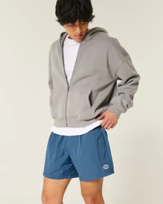 Pantalones cortos de fútbol holgados hasta la mitad del muslo
