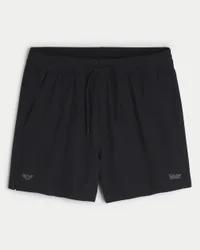 Pantalones cortos deportivos con logotipo a media pierna