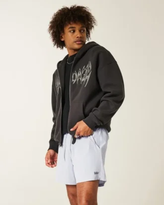 Pantalones cortos deportivos con logotipo a media pierna
