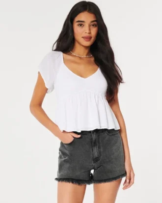 Pantalones cortos mom de denim negro desgastado de talle ultraalto