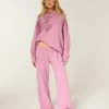 Pantalones de chándal anchos con estampado de rosas brillantes