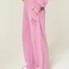 Pantalones de chándal anchos con estampado de rosas brillantes