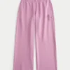 Pantalones de chándal anchos con estampado de rosas brillantes