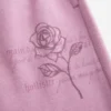 Pantalones de chándal anchos con estampado de rosas brillantes