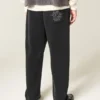 Pantalones de chándal holgados con bordado de araña