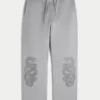 Pantalones de chándal holgados con estampado de doble serpiente