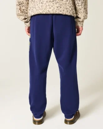Pantalones de chándal holgados con estampado gráfico de los Wolverines de la Universidad de Michigan