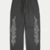 Pantalones de chándal superholgados con gráfico de doble llama