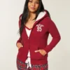 Sudadera con capucha, cremallera y logo gráfico, con forro de sherpa, de la colección Holiday Vault