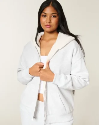Sudadera con capucha reversible con forro de piel sintética y cremallera