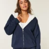 Sudadera con capucha reversible con forro de piel sintética y cremallera