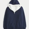 Sudadera con capucha reversible con forro de piel sintética y cremallera