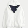 Sudadera con capucha reversible con forro de piel sintética y cremallera